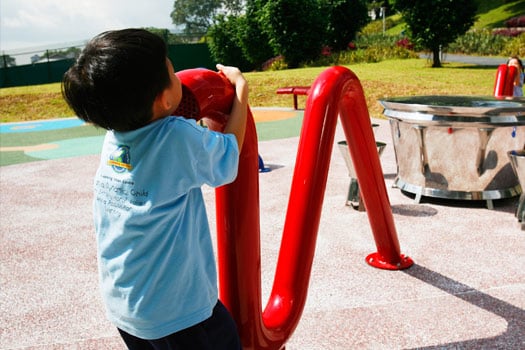 child playing with telephone tube