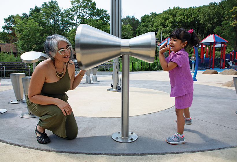 grandmother playing with granddaughter in the park